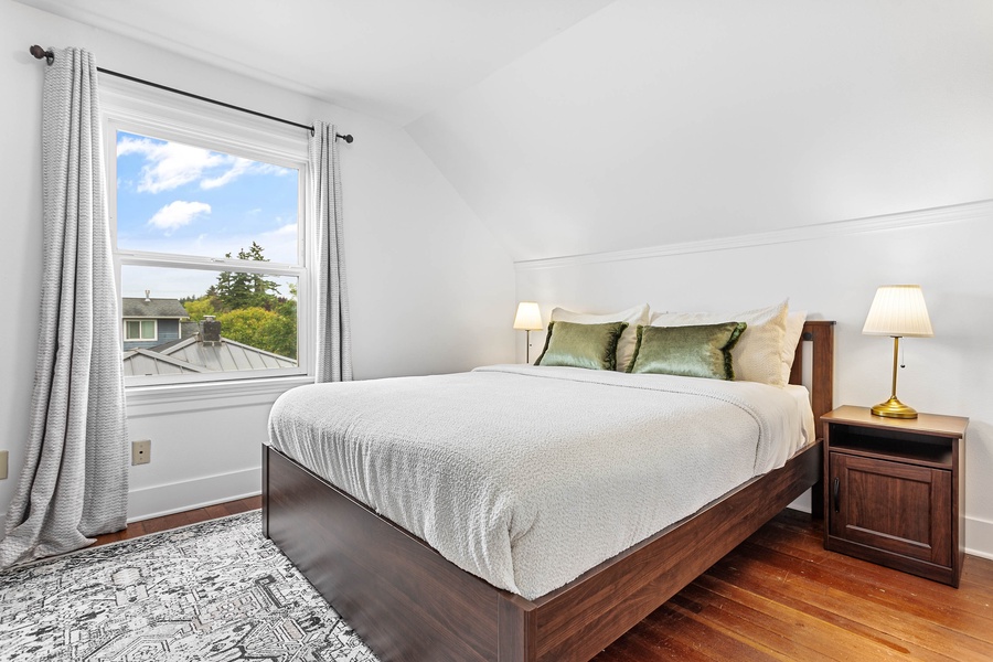Wake up to treetop views and calm ambiance in this light-filled king suite.