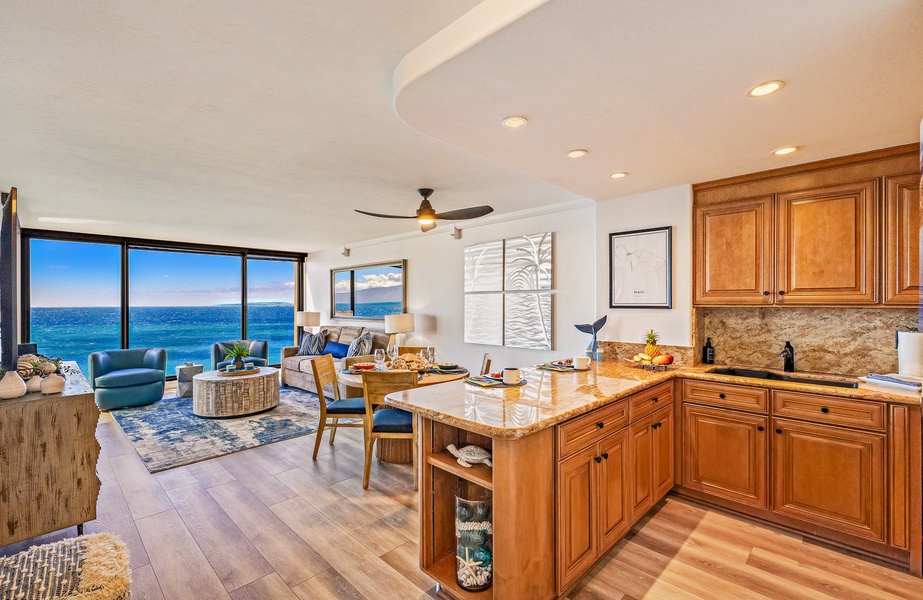 Mahana 1118’s kitchen offers granite countertops and warm wood cabinetry.