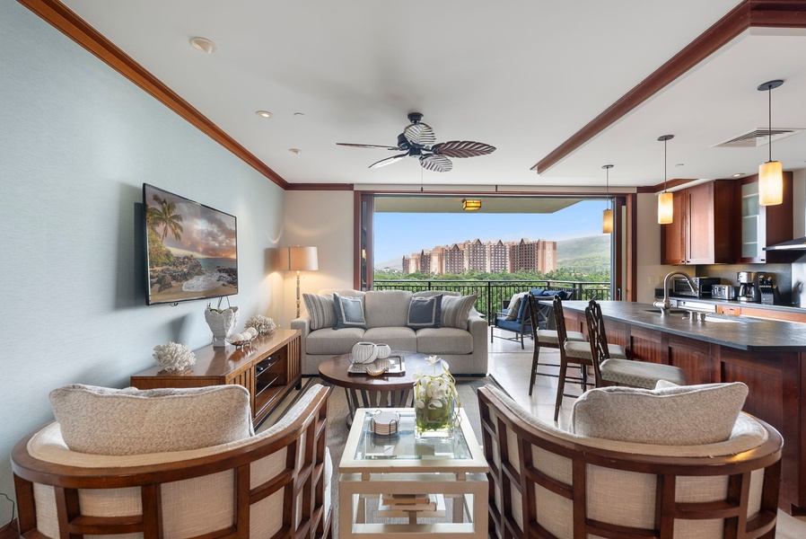 Unwind in your stylish living space where warm wood tones and elegant furnishings create the perfect retreat after island adventures.