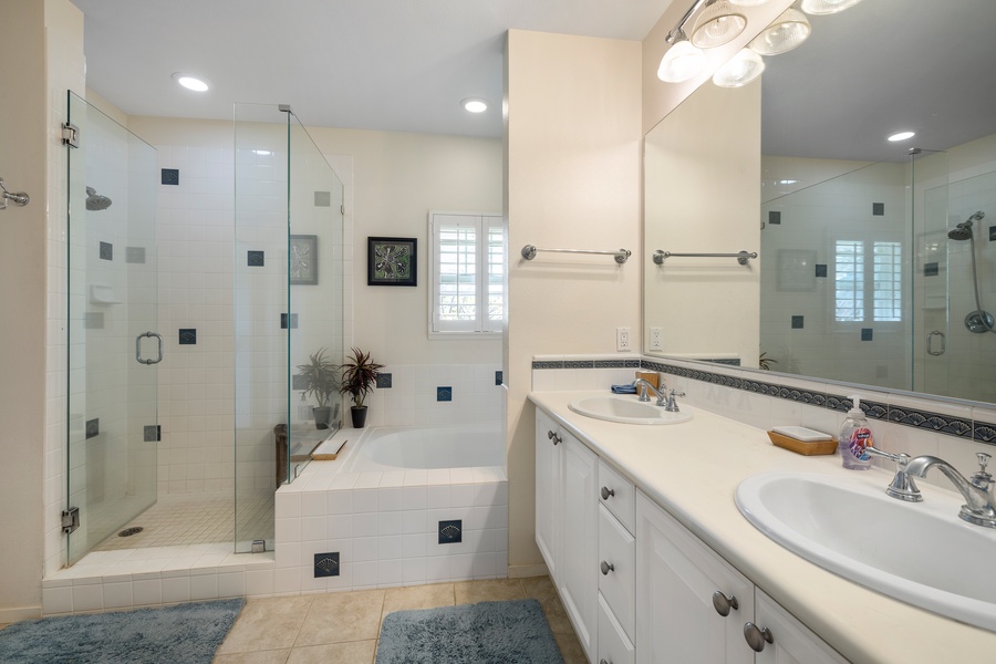The primary guest bathroom with a soaking tub and double vanity.