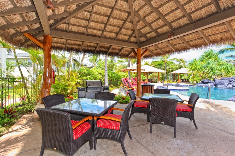 BBQ and dine under the cabana located poolside near the loungers.