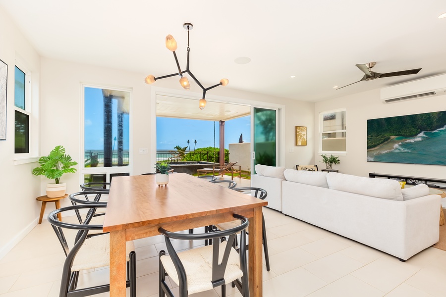 Dining area with ocean views, natural wood accents, and seating for a memorable meal.