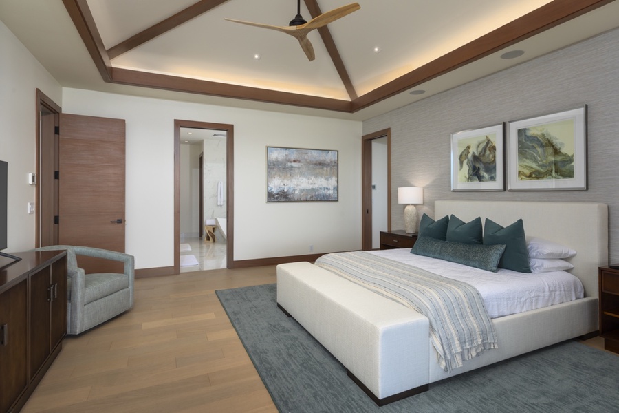 The primary suite has lofted ceilings, storage and ensuite bath.