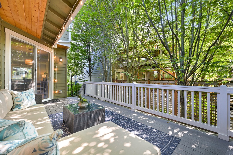 This tranquil patio retreat is shaded by mature trees and perfect for laid-back afternoons.