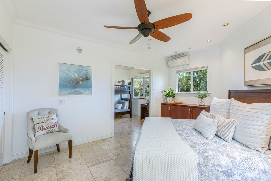 Spacious guest suite with king bed, plush linens, and serene views — a perfect retreat after a day of exploring Kauai.