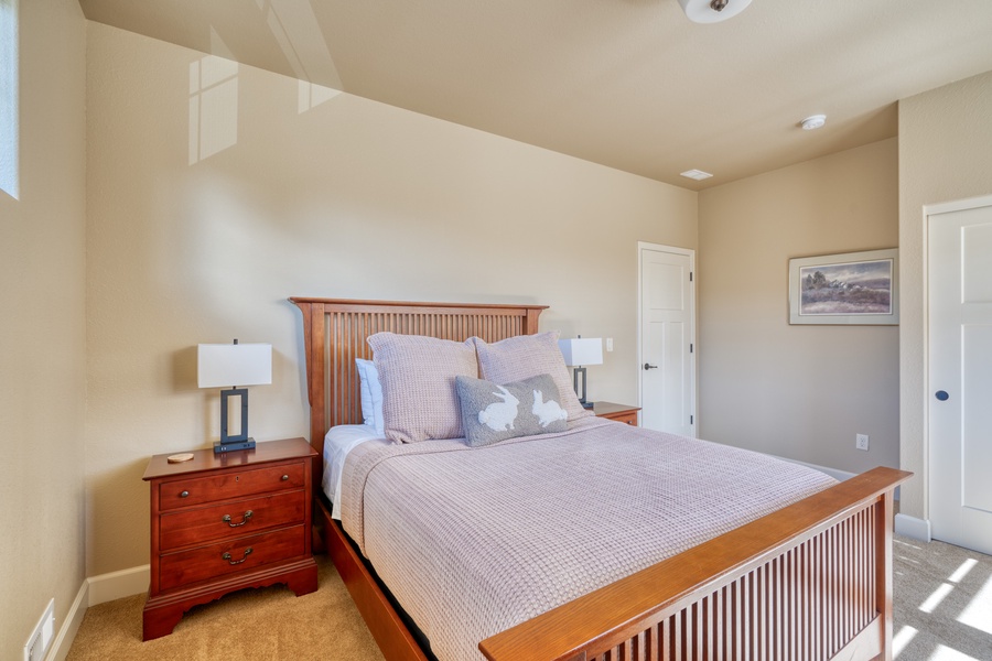 The second bedroom features a Queen-sized bed, offering a spacious and comfortable sleeping arrangement