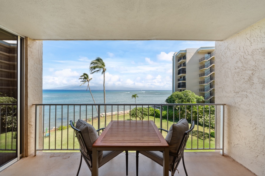 Royal Kahana 308's lanai offers a quiet retreat for meals, card games, or simply gazing out over the lush palms and rolling surf.