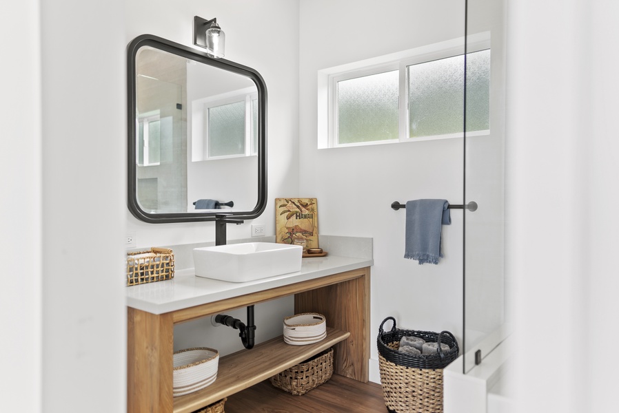 Ensuite bathroom with a chic vanity area, ideal for getting ready in style.
