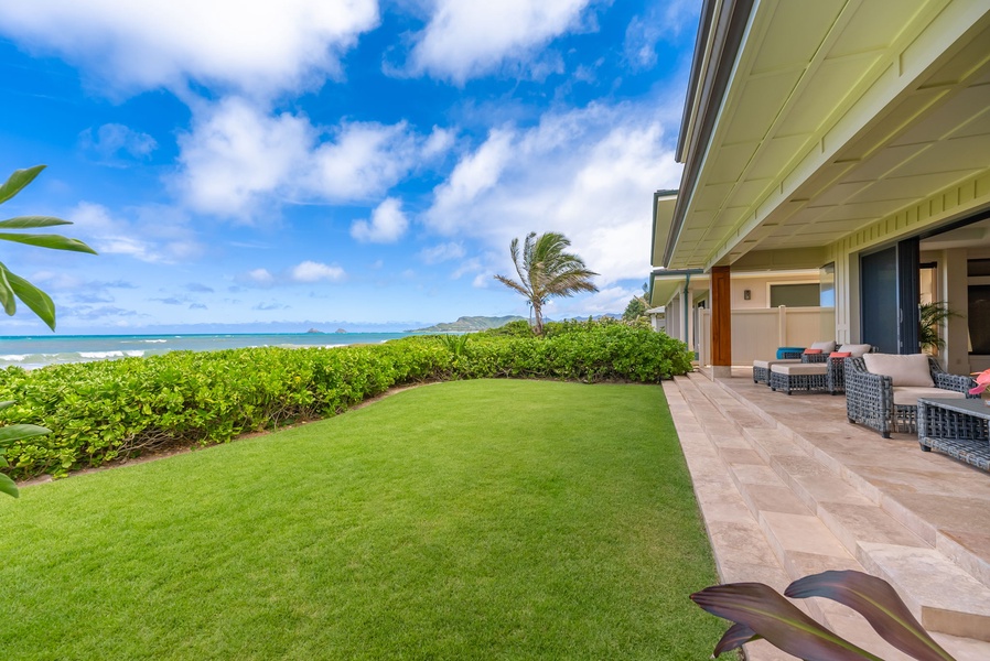 Enjoy the lush manicured lawn and ocean views from the large covered lanai.