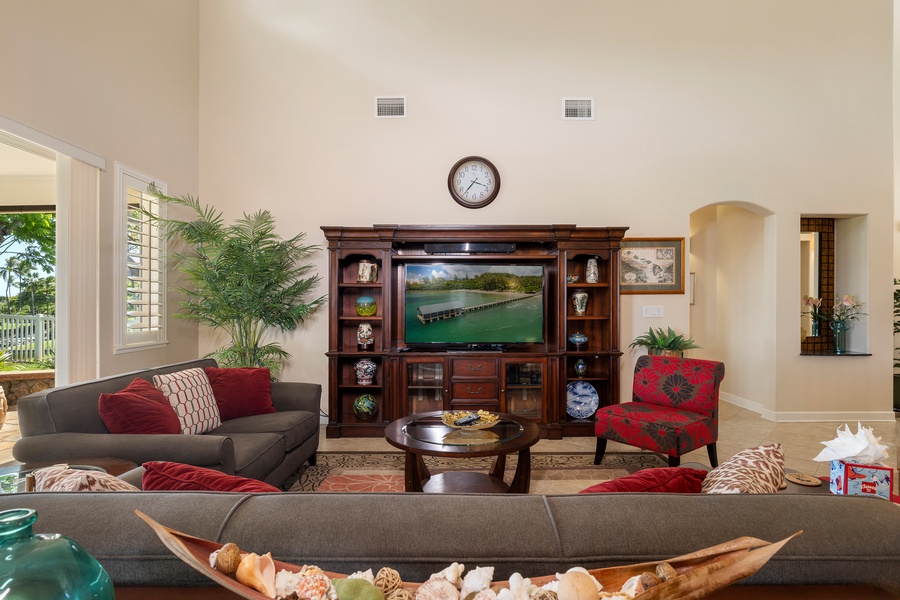 Unwind in this elegant living room where plush seating and entertainment center create the perfect space for relaxation.
