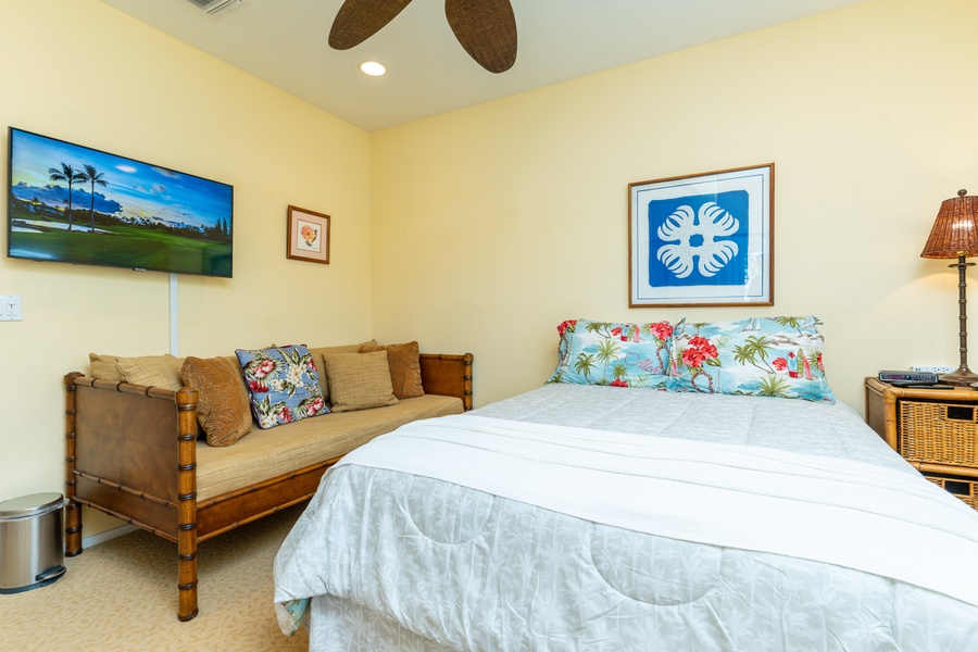 The third guest bedroom with generous furnishings and TV.