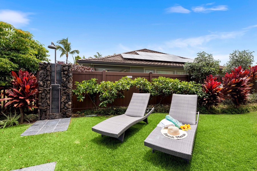 Sunny garden retreat with comfortable loungers, perfect for a relaxing day outdoors.