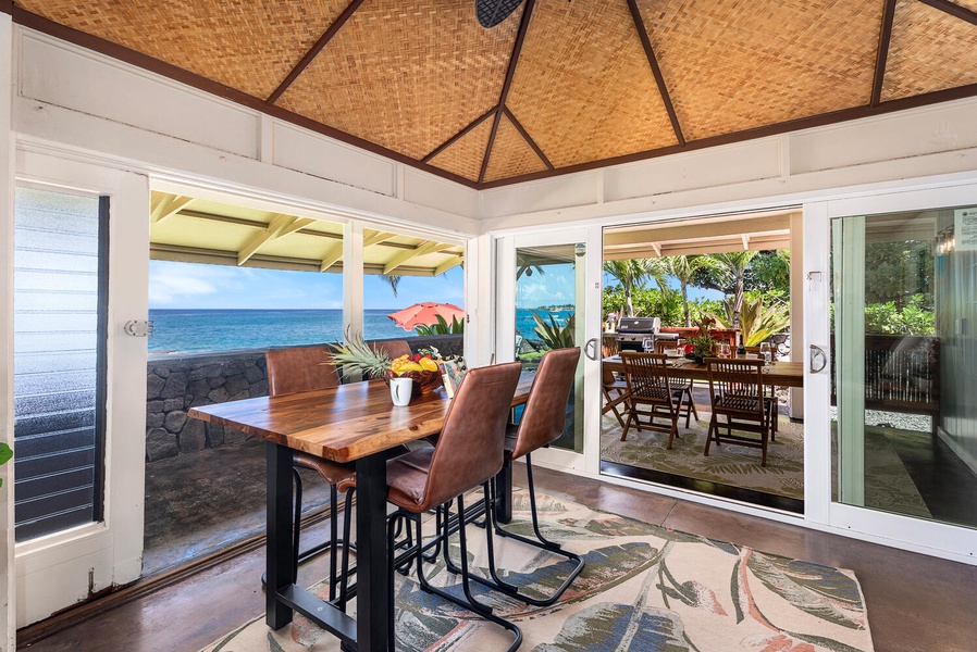 Elevated lanai bar seating for enjoying sunset cocktails by the sea.