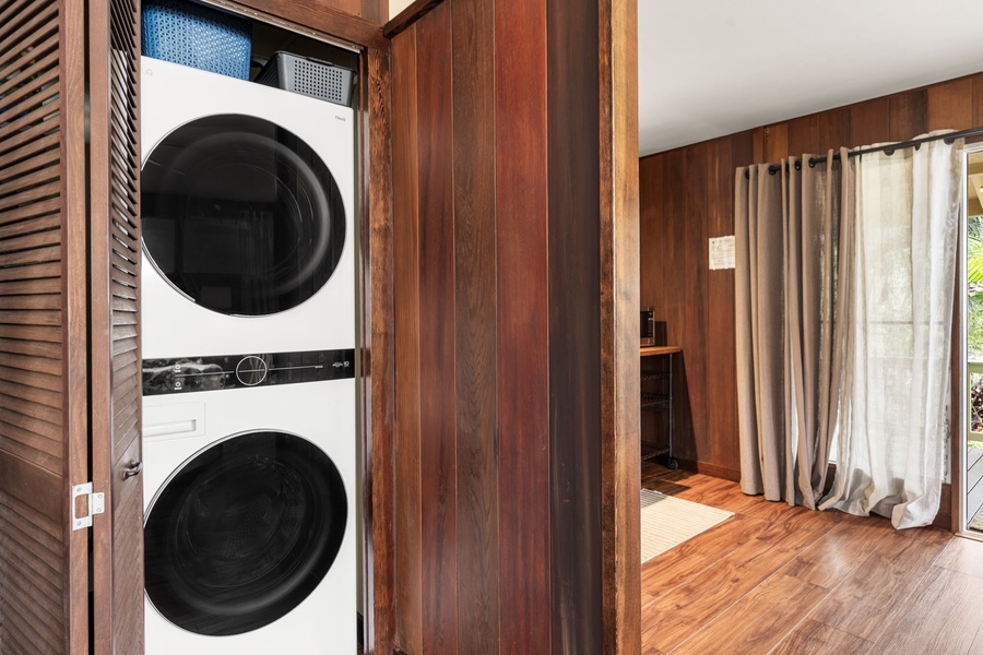 Your washer and dryer are neatly tucked behind louvered doors, keeping your vacation space tidy while making it easy to refresh your wardrobe during your stay.