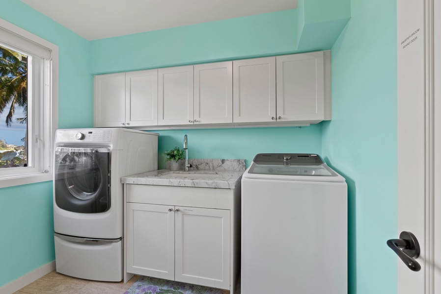 Dedicated laundry room with full-size washer and dryer