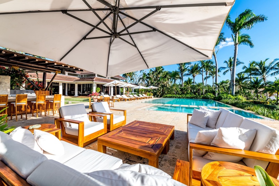 Relax or gather by the pool, taking in the stunning view of Casa de Campo.