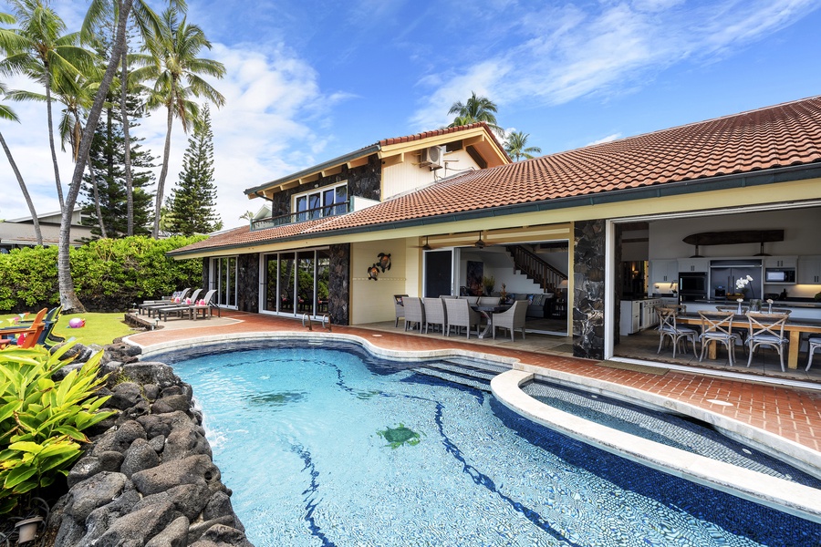 View from the back side of the pool looking back towards the home