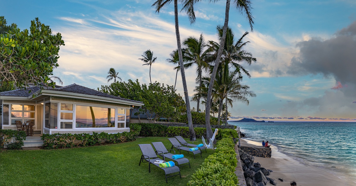 Chaise lounges lie at the property's edge overlooking Lanikai Beach