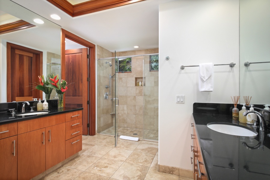 Primary ensuite bath with dual sinks, large glass enclosed shower private W/C and soaking tub.