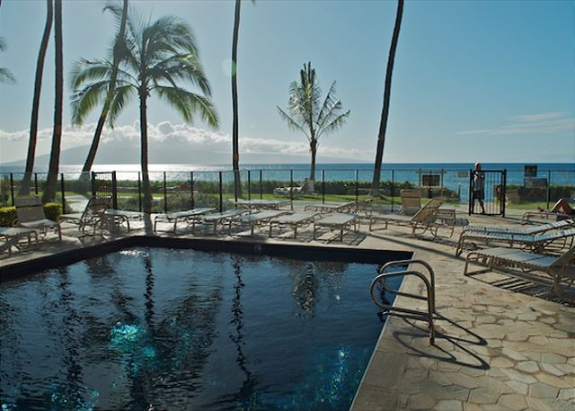 Enjoy a refreshing dip in the pool with stunning ocean views, just steps away from the beach. Perfect for relaxing in paradise.