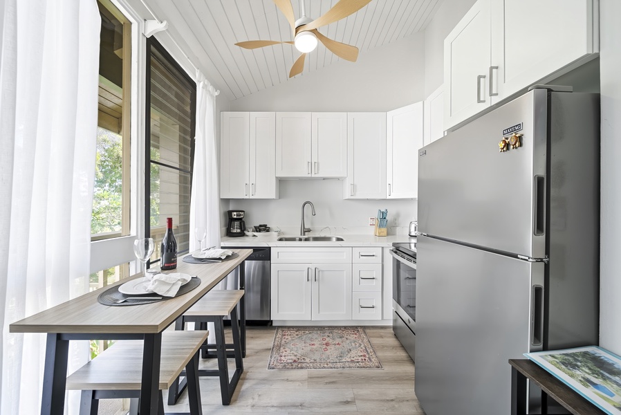 The galley kitchen keeps everything within reach, from the stove to the breakfast counter.