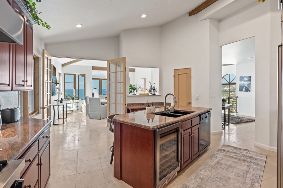 The open floor plan and functionality of this home will impress every chef.  Wine cooler and dishwasher in the island for perfect service.