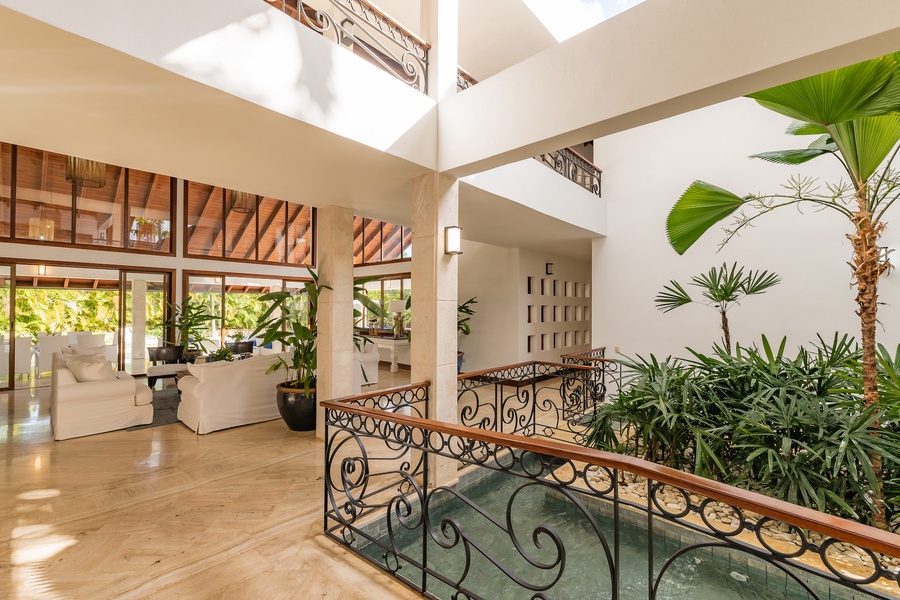Bright and airy interior with elegant décor and indoor greenery.