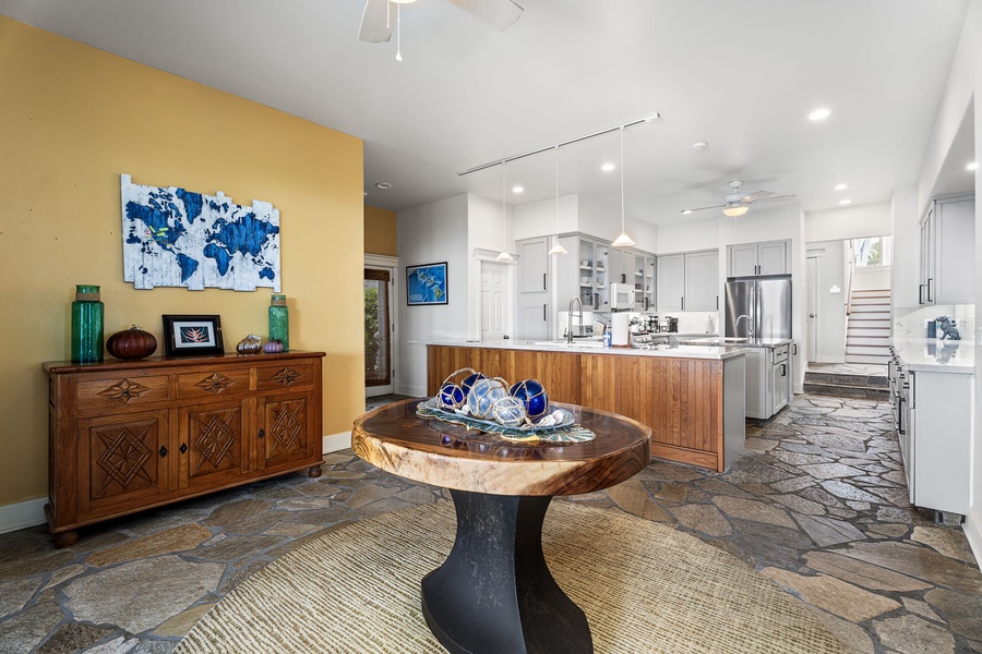 Natural light fills this casual dining space with seamless access to the kitchen and lanai.