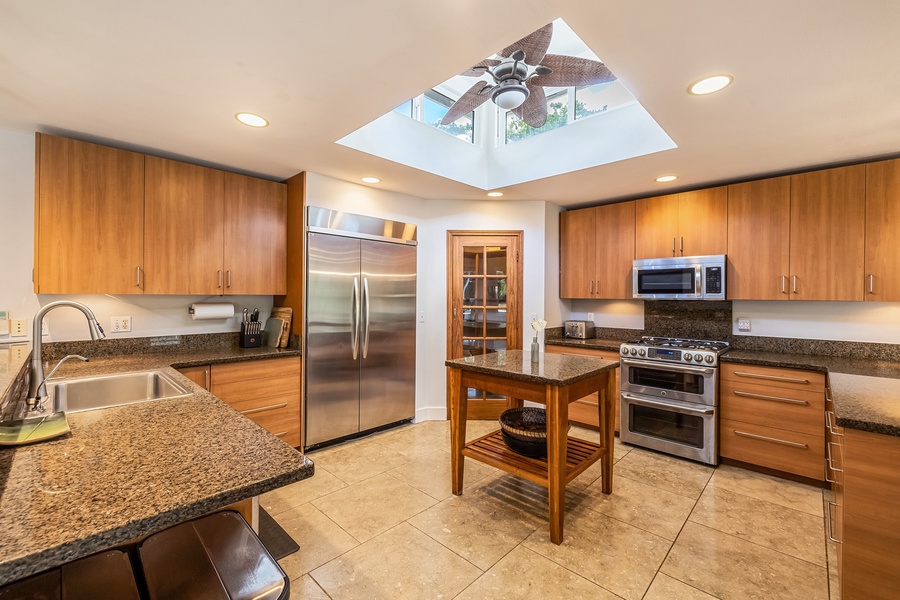 The kitchen is equipped with stainless steel appliances