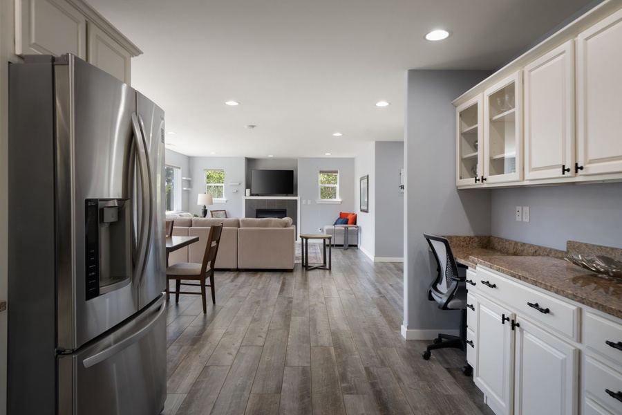 The open kitchen design keeps everyone connected, whether preparing meals, gathering at the dining table, or relaxing nearby.