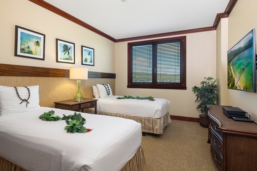 The third bedroom with twin beds, with views, flat screen tv and plenty of storage.