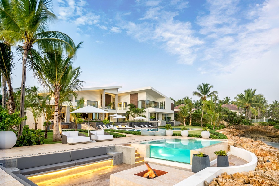 Relax in style at this outdoor fire pit and sparkling pool.