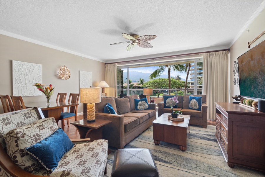 Stylish furnishings and ceiling fans enhance your comfort in the living area of Honua Kai Konea 204.