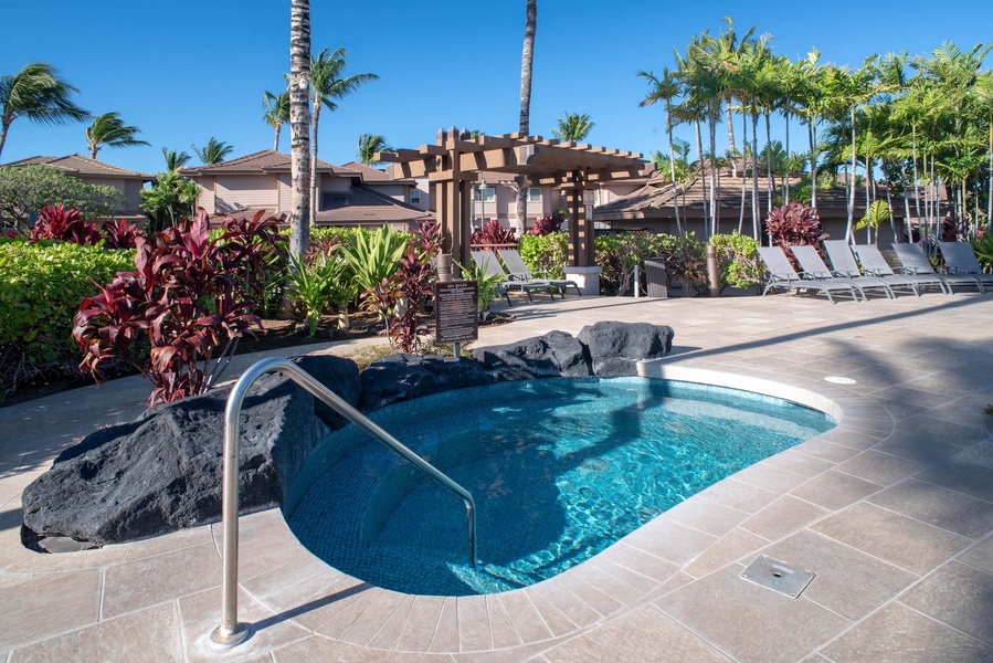 Unwind in the community jacuzzi, nestled under a pergola and surrounded by palms—ideal after a day of island adventures.