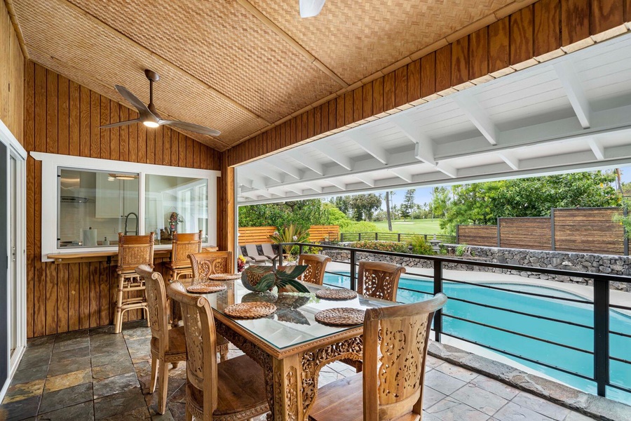 Dine al fresco on the lanai with pool view.