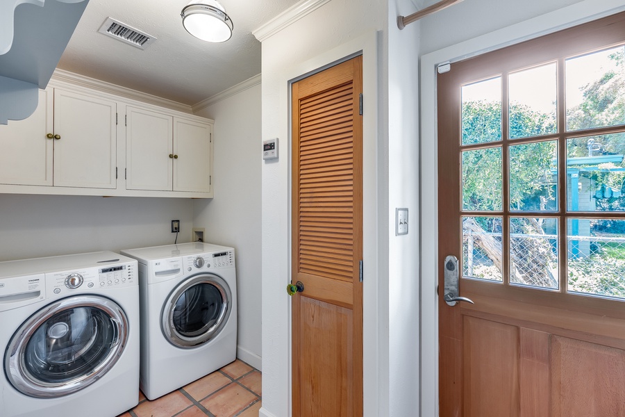 Laundry room with a washer and a dryer for your convenient staycation!