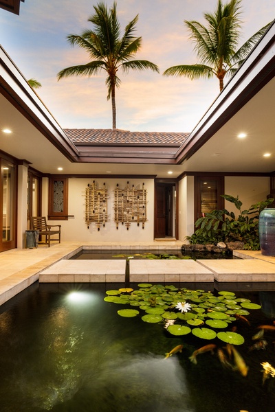 Tranquil courtyard with koi pond and island greenery welcomes you to your private oasis.