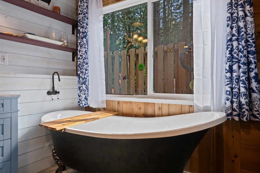 Soak away your cares in the clawfoot tub while gazing out to the garden—your private spa moment awaits.