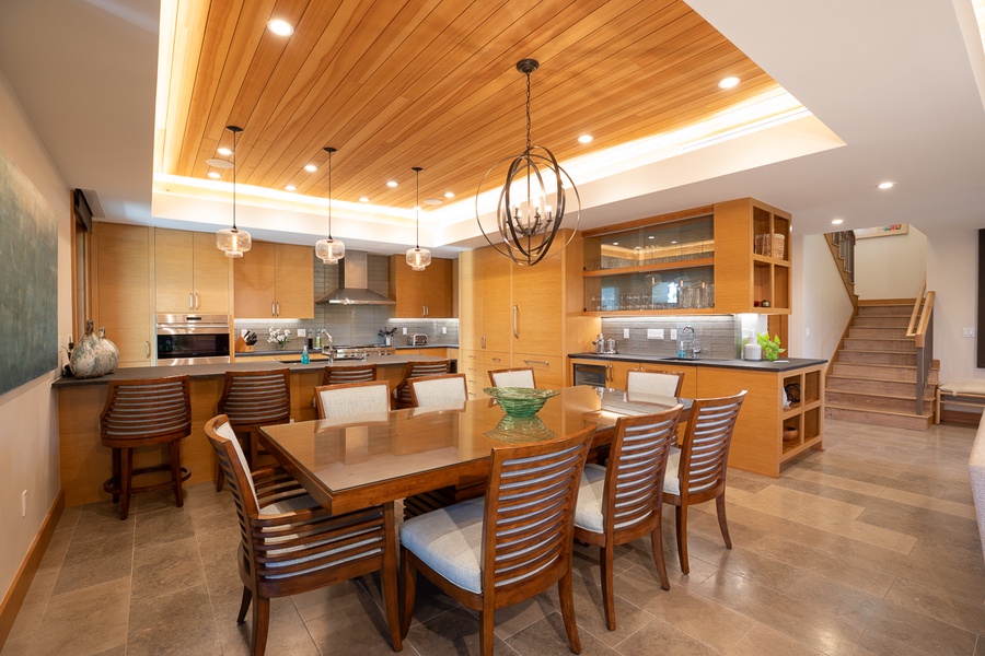 Dining table that has eight seats with extra seating at the kitchen bar