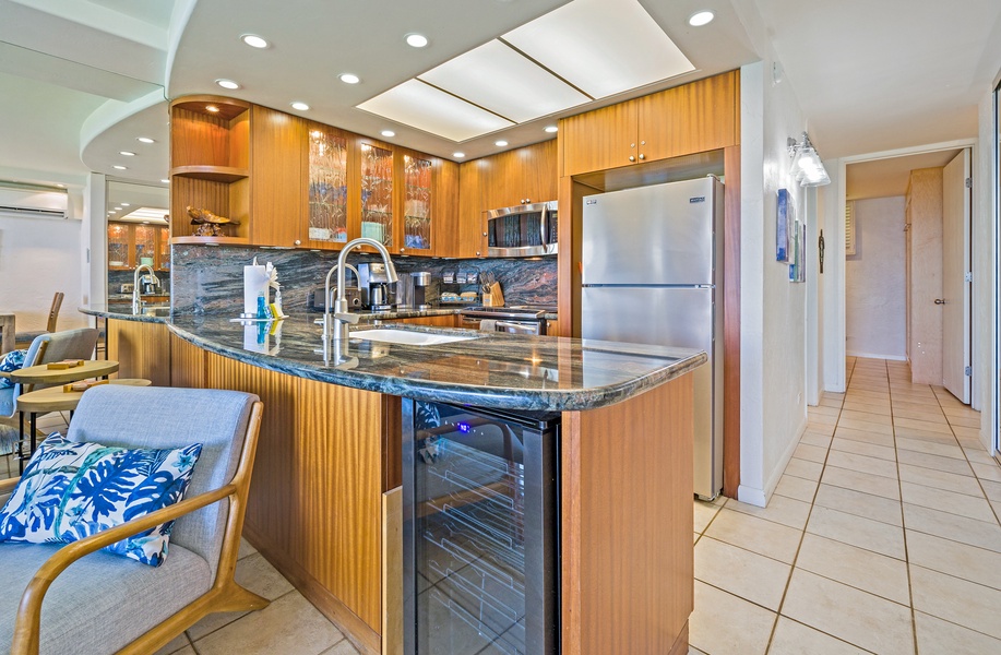 Papakea L-106 features a spacious kitchen island with extra counter space and a wine cooler