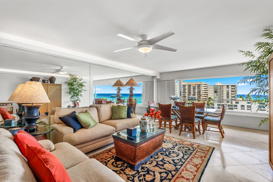 Lounge in style in the airy living room, where island décor, natural light, and the sound of the waves create the perfect setting for relaxed conversation or quiet reflection.