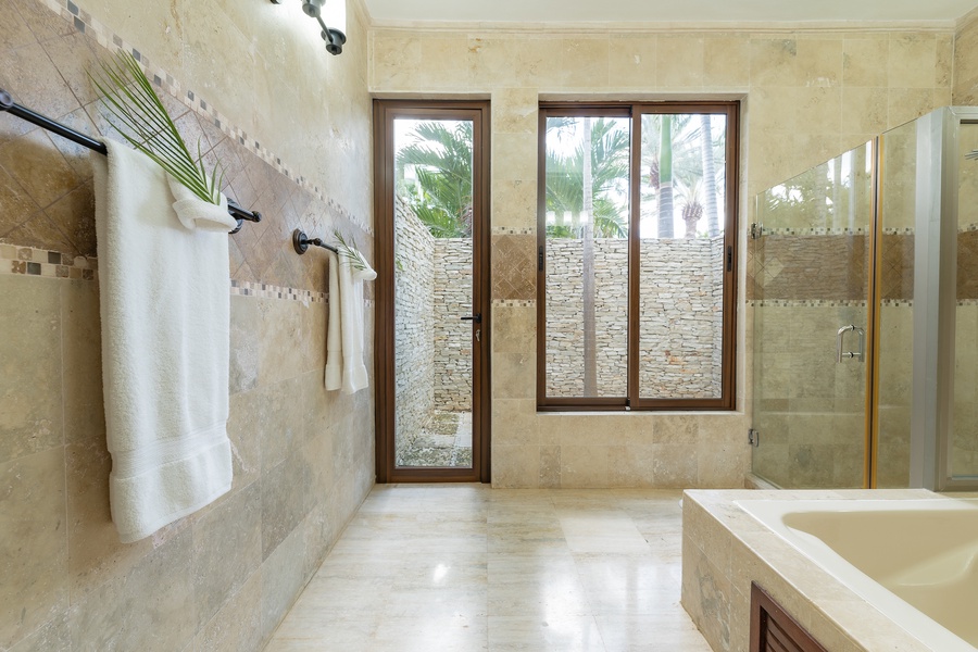Luxurious amenities for a spa-like experience in this full bathroom.