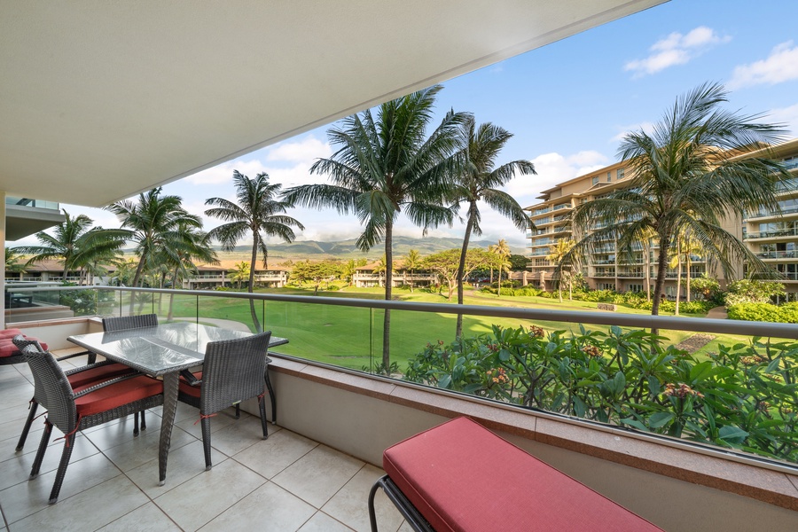 Tropical foliage and golf course views set the stage for relaxed mornings on the lanai of Honua Kai Konea 204.
