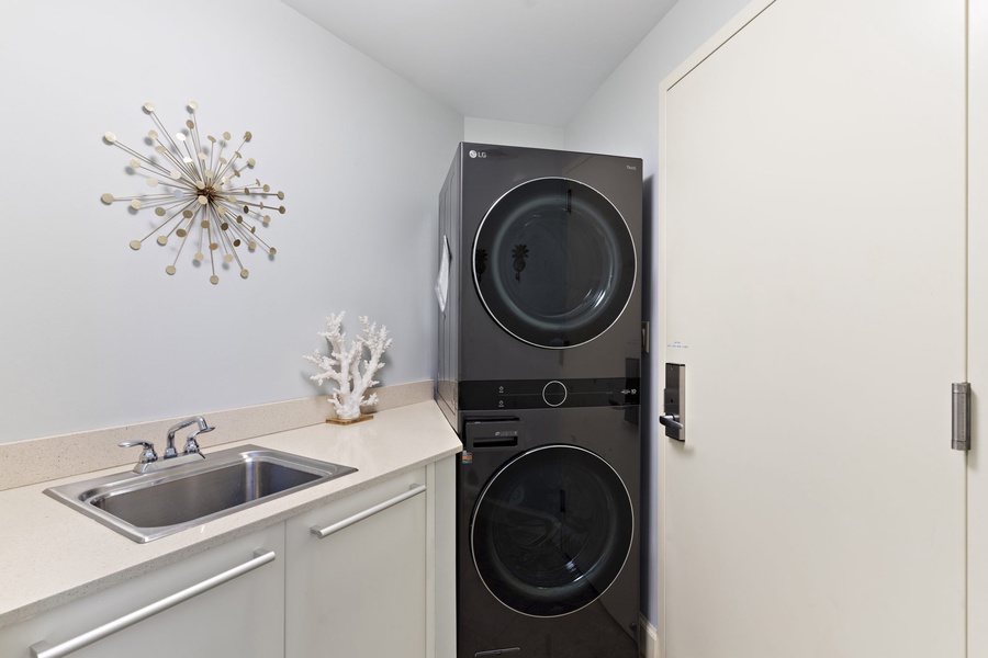 The in-unit laundry area has washer and dryer.