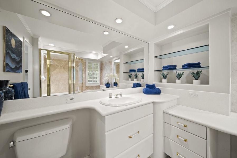 Ensuite primary bathroom with an enclosed shower and a jetted tub