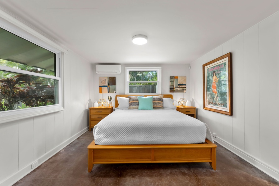Cozy guest bedroom featuring a plush bed, natural light, and tranquil tones for restful nights.