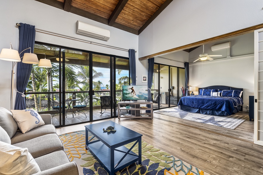 Living room looking towards the primary bedroom with sliding doors