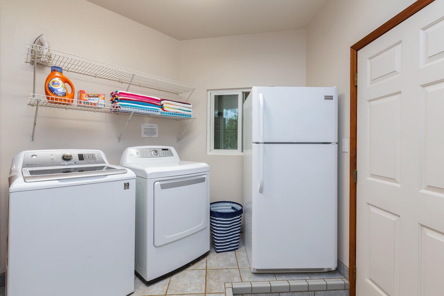 Laundry room with washer and dryer, and an additional refrigerator