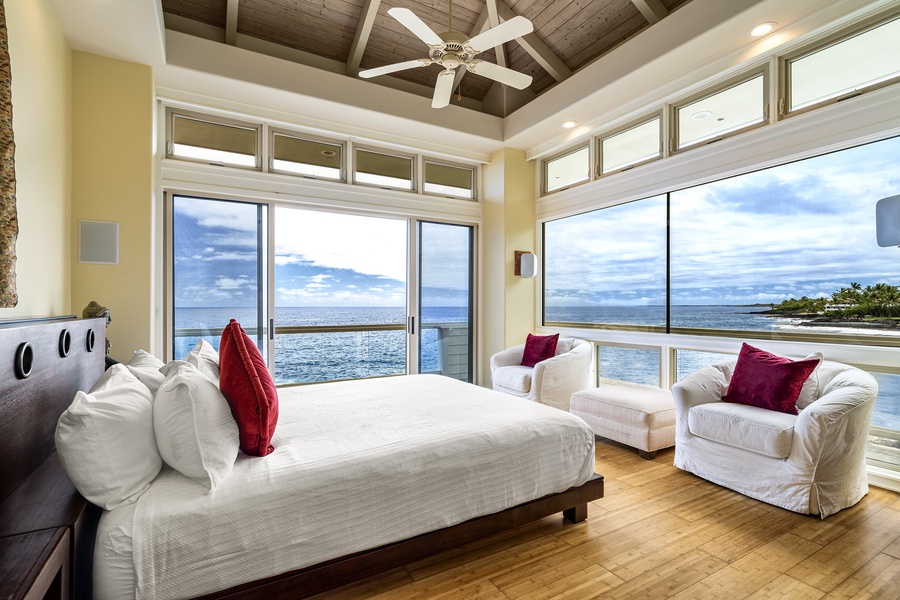 Primary bedroom fit for royalty—California king bed, ocean views, and luxurious natural light.
