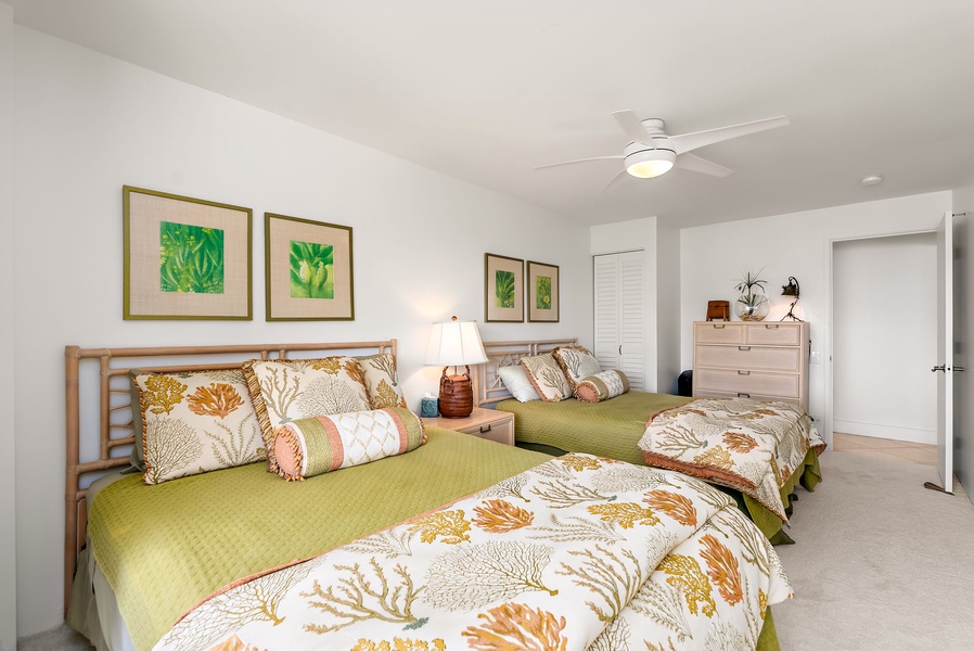 Stylish second bedroom with both queen and double beds, ideal for multi-generational groups or shared stays.